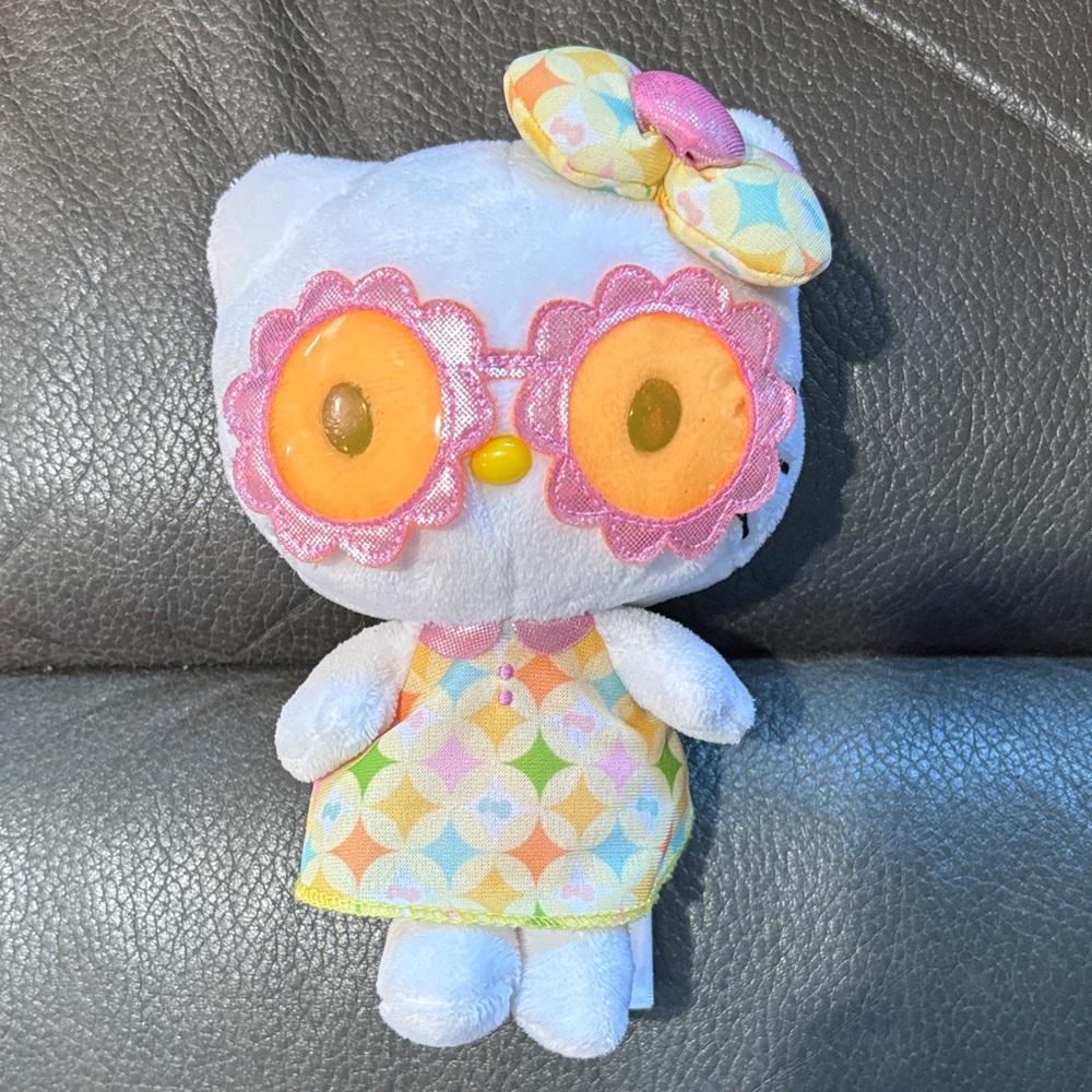 Hello kitty stuffed animal with sunglasses and cute dress and matching bow